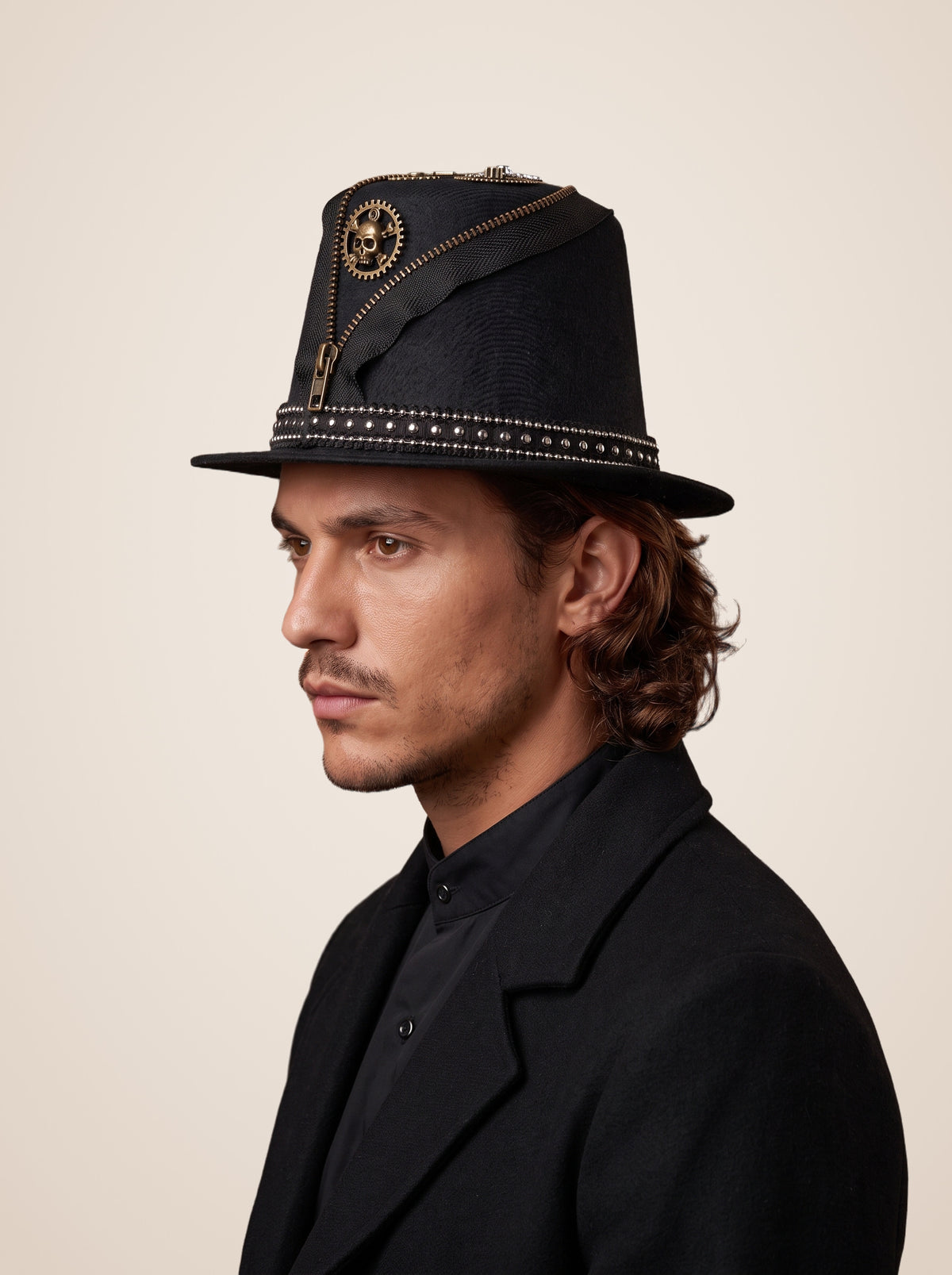 Zippered Skull Gear Studded Top Hat in Black, worn by a model, side profile