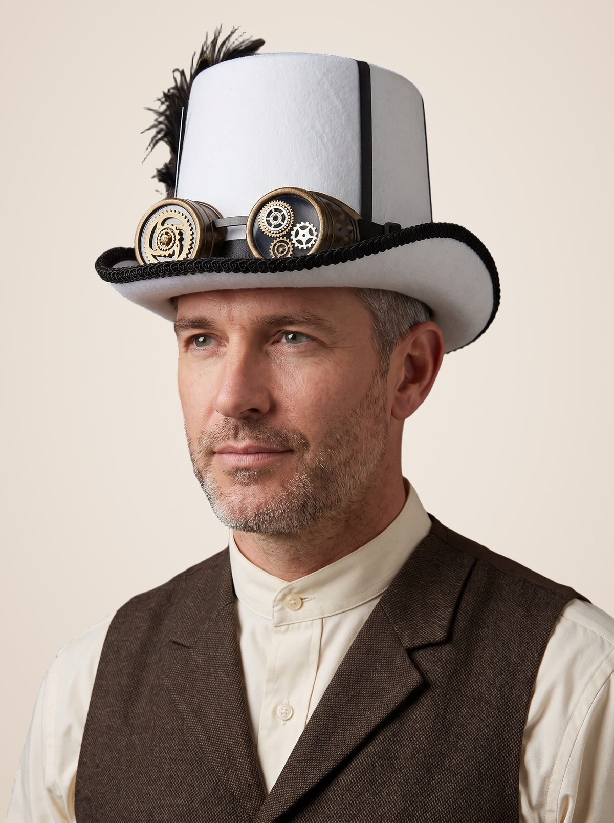 Feathered Gear Goggle White Top Hat in White, worn by a model, front left, seen from above, picture 1