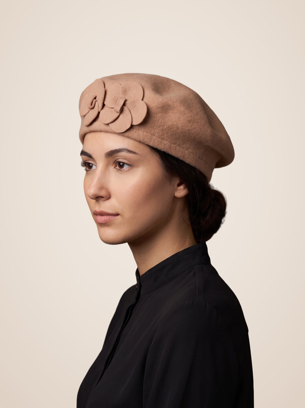 Layered Petal Rosette Wool Blend Beret in Camel, worn by a model, front view